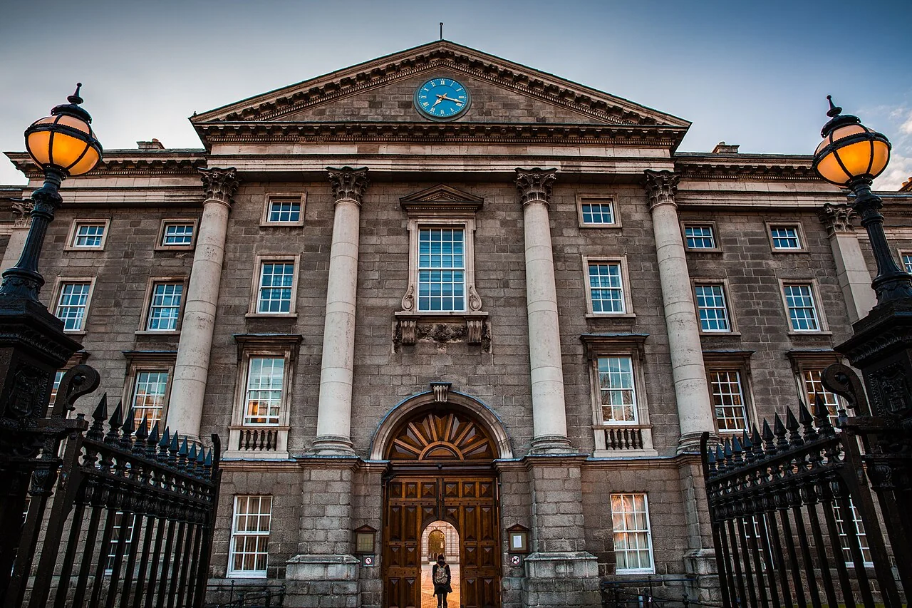 The entrance of the historic Trinity College (Unsplash) — representative context visual. Shown from the cited image source.